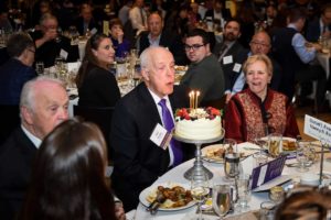 Former Governor of Washington State, Dan Evans, blowing out his birthday cake candles