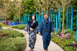 Portrait of a couple walking in kimono at Chihuly Garden in Seattle