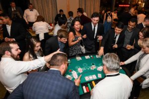 Corporate party with employees playing poker at The Four Seasons in Seattle