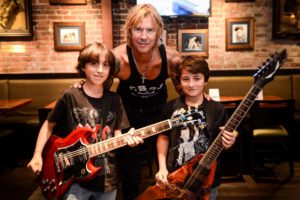 Duff McKagan posing during boy's Make-A-Wish event at Hard Rock Cafe in Seattle