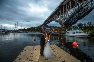 Wedding photo taken on the dock in Fremont at Lake Washington Rowing Club