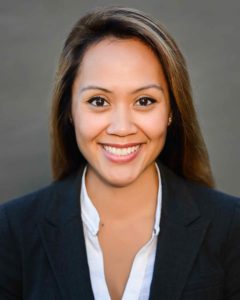 Corporate female headshot with gray backrop in Seattle