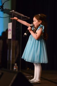 4-year-old girl entertains on stage for large crowd at Westin Hotel