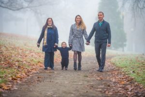 Family portrait during a foggy morning at Wright Park in Tacoma