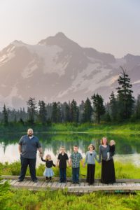 Adventure portrait of family at Mt. Baker with Mt. Shuksan in background