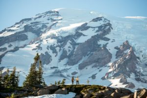 Couple looking at mt. rainier as they hold hands