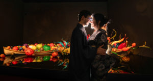 Couple facing each other and smiling at Chihuly Garden and Glass.