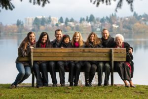 Portrait of family sitting on park bench in Seattle at Green Lake