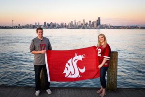 WSU Coug couple doing engagement photos with Seattle cityscape in background