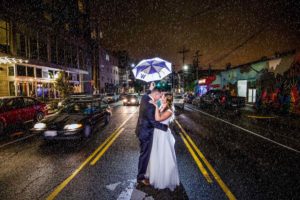 UW wedding couple in the rain