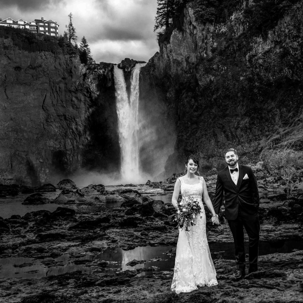 Wedding couple at Snoqualmie Falls holding hands
