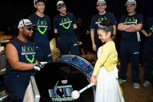 Seahawks band with little girl drumming