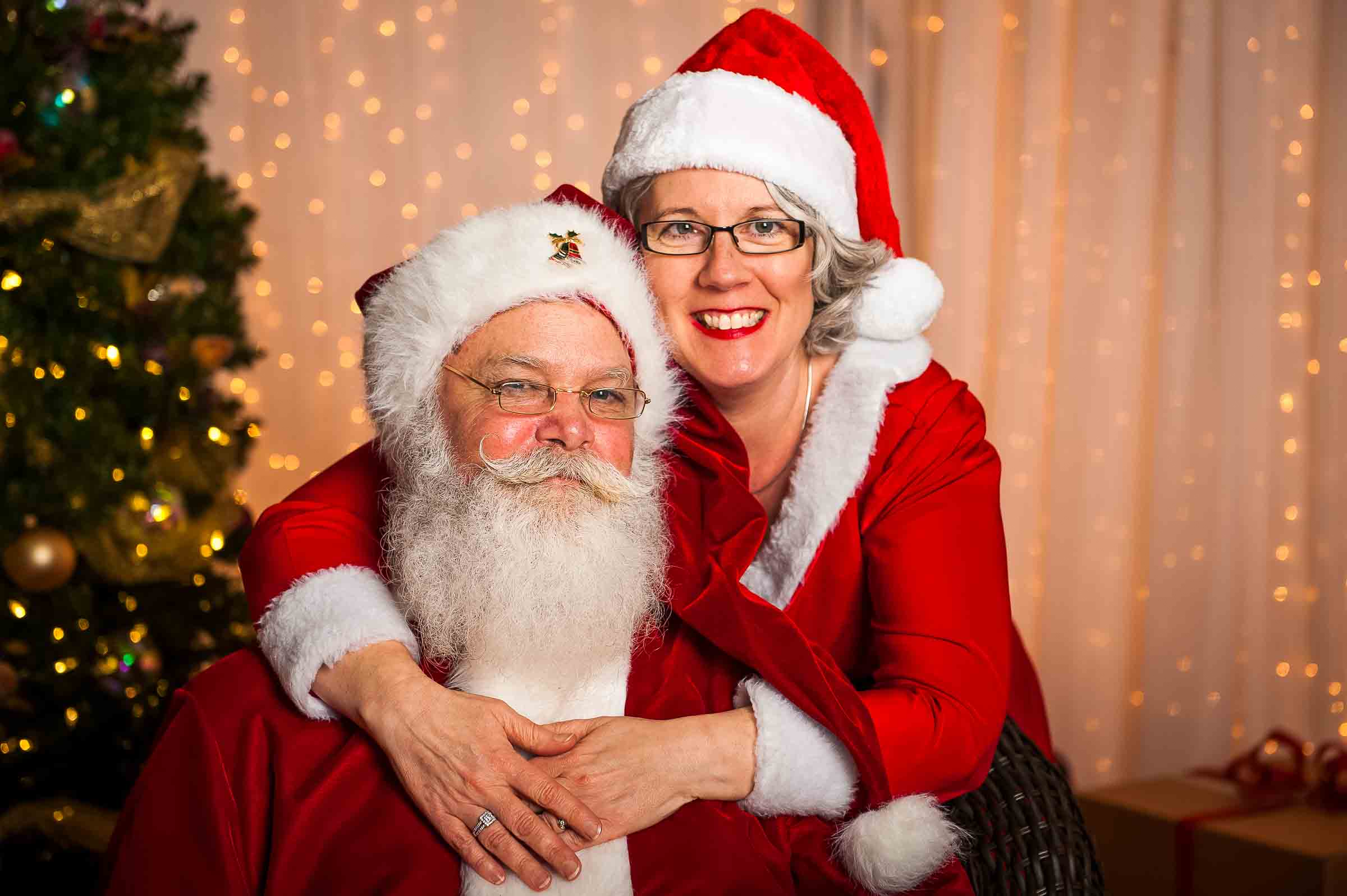 Santa Clause and Mrs. Clause smiling